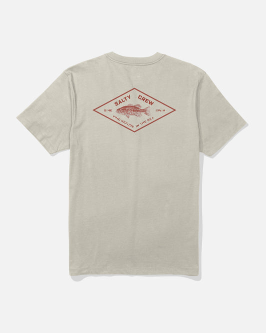 The Salty Crew Diamond Bass Crew Tee in Bone is a short-sleeve cotton t-shirt shown from the back, featuring a screenprinted red diamond-shaped graphic with a fish in the center and the words “Salty Crew,” “Sink or Swim,” and “Find Refuge in the Sea.”.