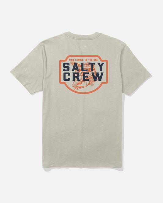 Introducing the Salty Crew Red Drum Crew Tee in Bone: a soft, combed ringspun cotton short-sleeve t-shirt in beige, featuring a large back screenprint with “Salty Crew” and “Find Refuge in the Sea” surrounding a fish illustration inside an orange-bordered shape—crafted for everyday comfort.