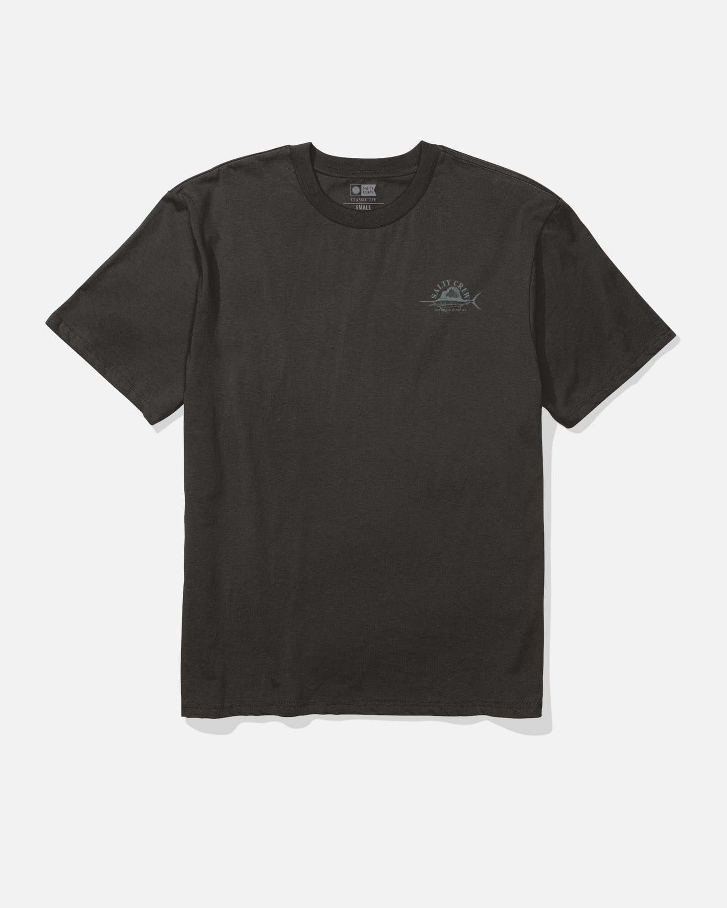 The Salty Crew Sailed Original Tee - Black is a plain short-sleeve t-shirt made from 100% soft spun cotton, featuring a small, subtle blue screenprinted graphic on the left chest and displayed laid flat on a white background.