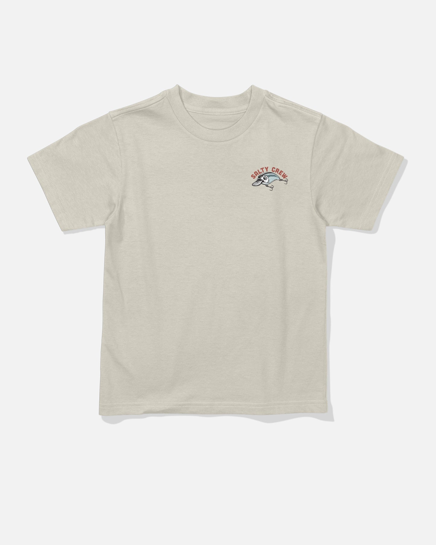 The Salty Crew Catch Me Toddler Tee in Bone is a beige, short-sleeve combed ringspun cotton t-shirt featuring a small screenprinted graphic of a leaping fish and the text “SILTY CREEK” in red on the left chest. The shirt is displayed laid flat on a white background.