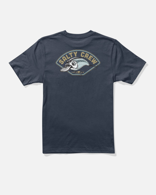 The Catch Me Boys Tee by Salty Crew is a navy blue T-shirt made from combed ringspun cotton, featuring a large vintage-inspired, nautical graphic of a fish and bold “Salty Crew” lettering on the back.