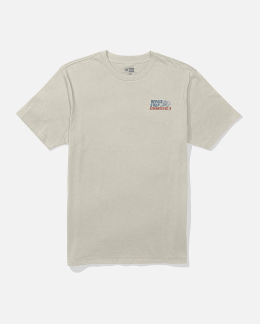 Bone short-sleeve cotton Reel Repair Crew Tee by Salty Crew, featuring a small screenprinted graphic and text on the left chest. The shirt is laid flat on a plain white background.