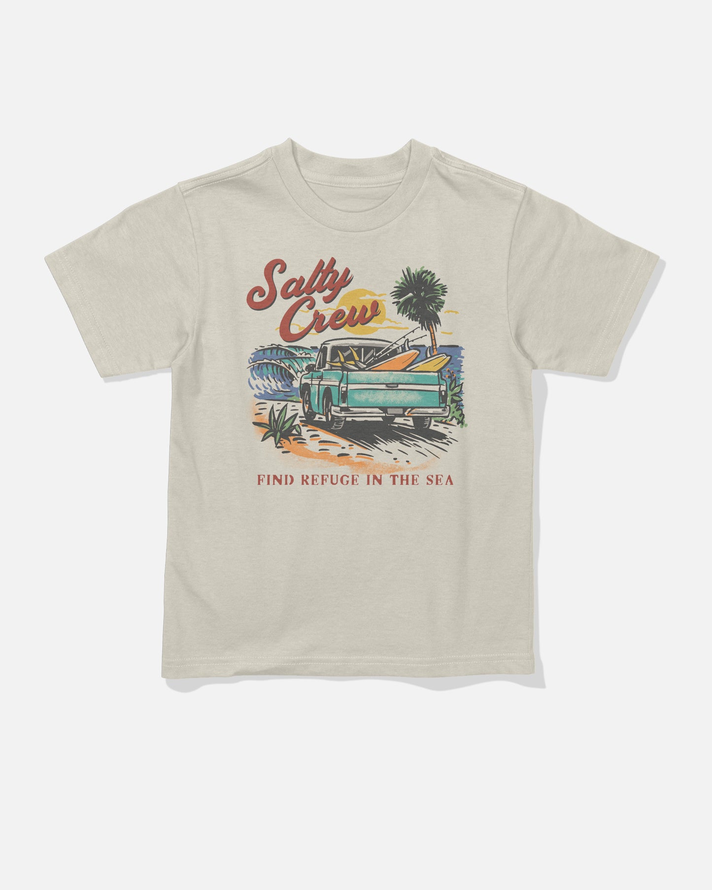 The Salty Crew Truck Bed Toddler Tee in Bone is a beige combed ringspun cotton t-shirt featuring a screenprinted graphic of a green pickup truck with surfboards, palm trees, and ocean waves. The design includes “Salty Crew” at the top and “Find Refuge in the Sea” at the bottom.