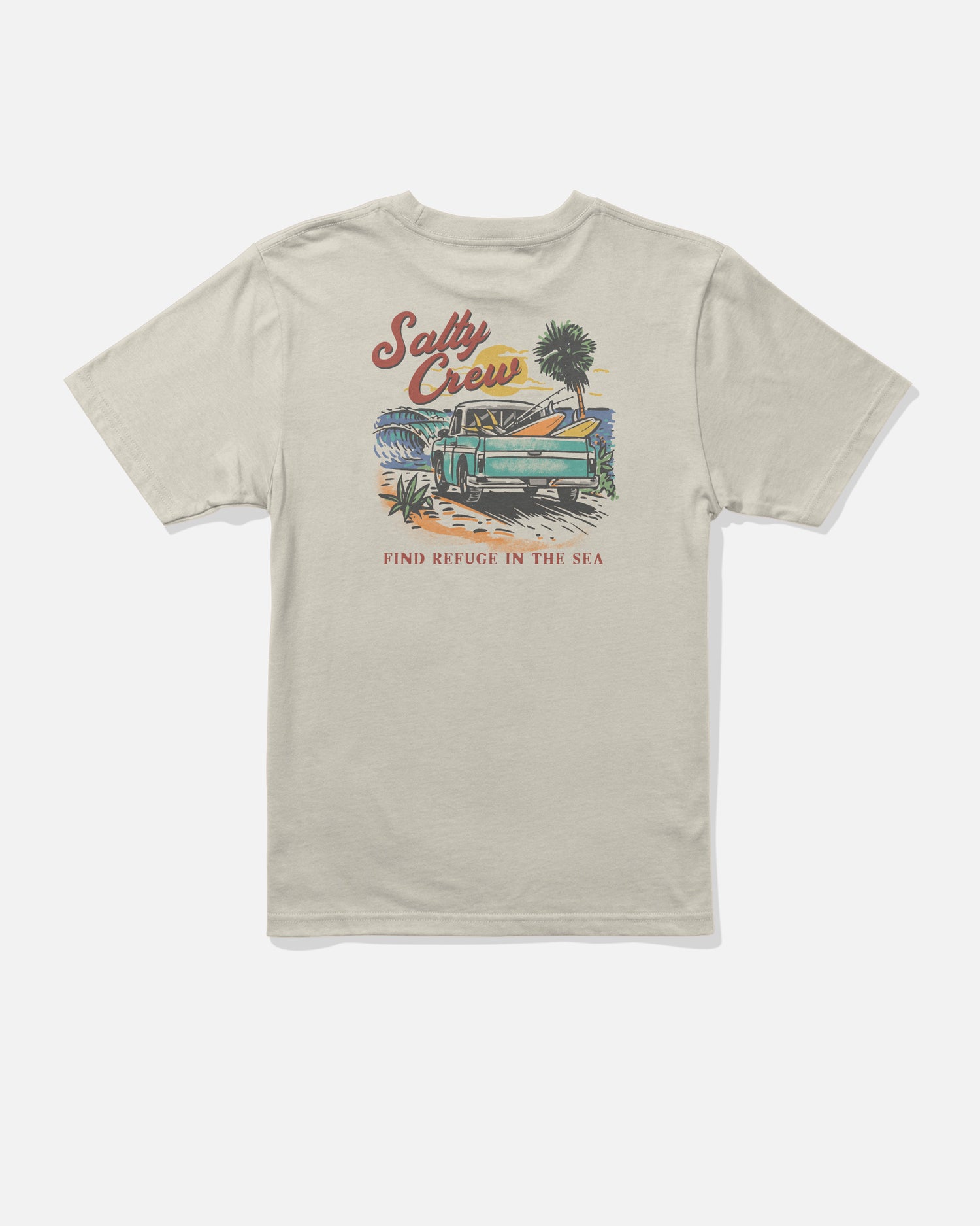 The Salty Crew Truck Bed Boys Tee in Bone features a beach scene with palm trees and a wooden boat screenprinted on soft, combed ringspun cotton for all-day comfort. “Salty Crew” is displayed at the top, while “Find Refuge in the Sea” is printed below the illustration.