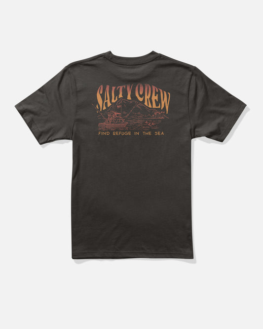 The Salty Crew Island Boys Tee in black features large orange “Salty Crew” text above a wave and boat graphic, crafted from soft combed ringspun cotton with screenprinted details. The phrase “Find Refuge in the Sea” is printed below the design.