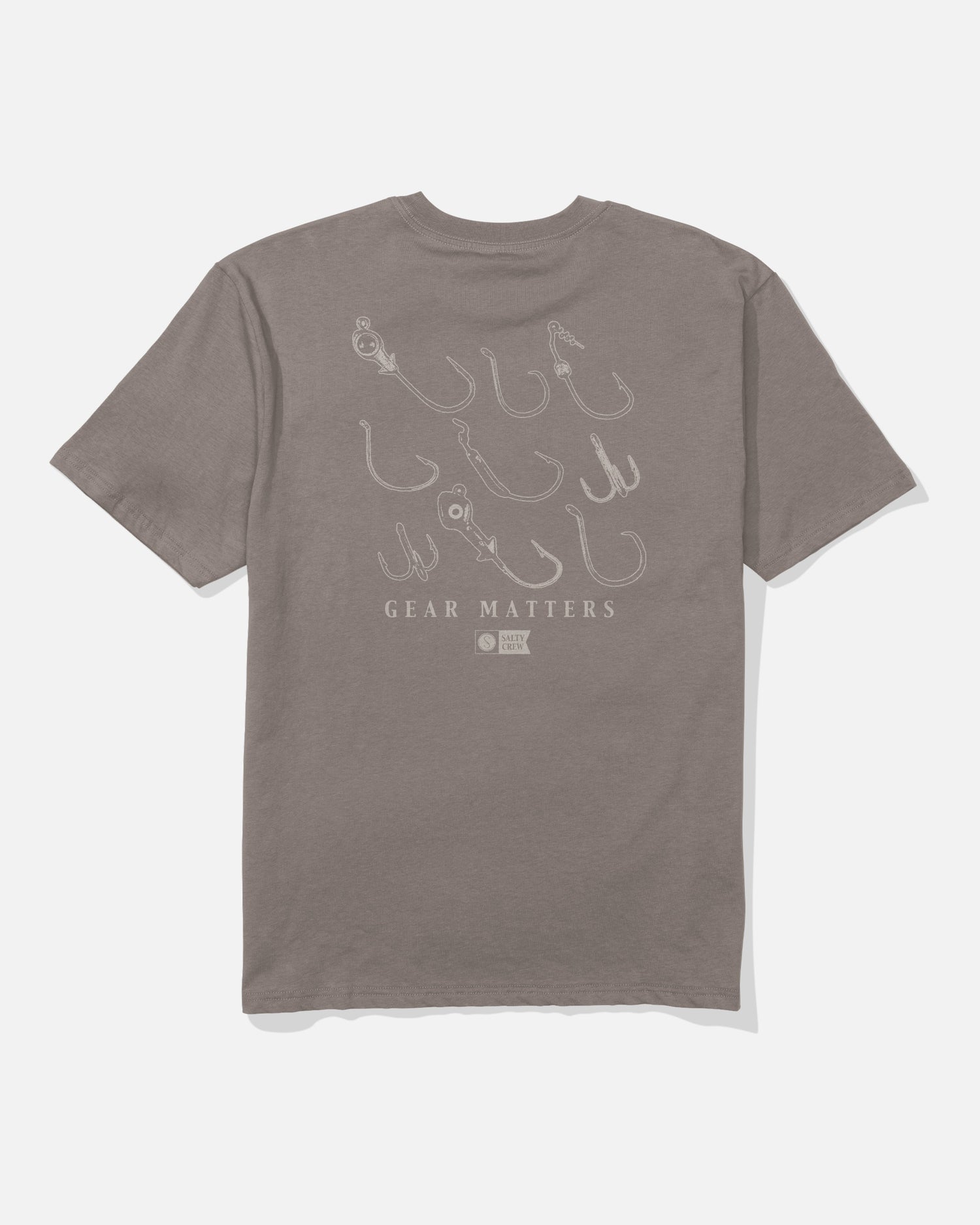 The Salty Crew Fish Gear Original Tee - Cinder is a gray, soft spun cotton t-shirt with screenprinted illustrations of various fishing hooks on the back and the text “GEAR MATTERS” below the drawings.
