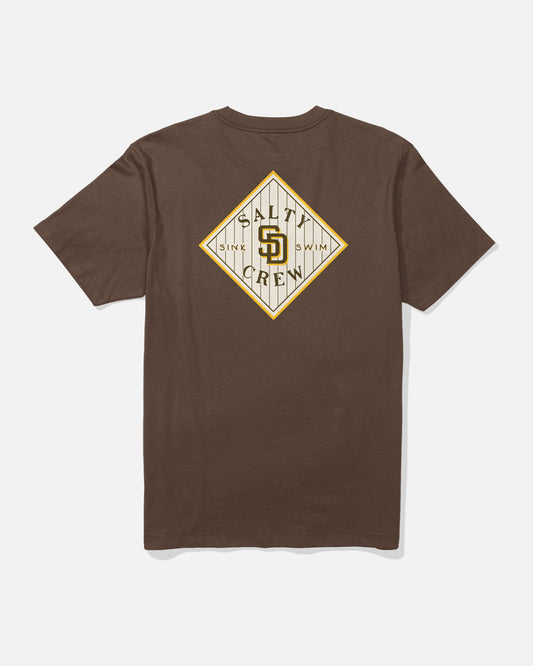 Introducing the Padres Tippet Tee in Brown by Salty Crew—a limited edition short-sleeve t-shirt featuring a diamond-shaped graphic on the back with “Salt Crew,” the phrases “Sink” and “Swim,” and a stylized SD logo at its center, perfectly capturing signature Salty Crew style.