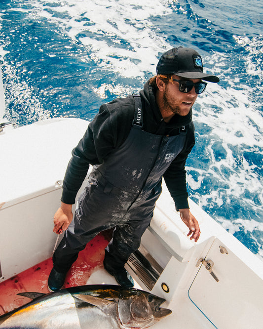 Lifestyle shot of the Long Range Bib - Black. 