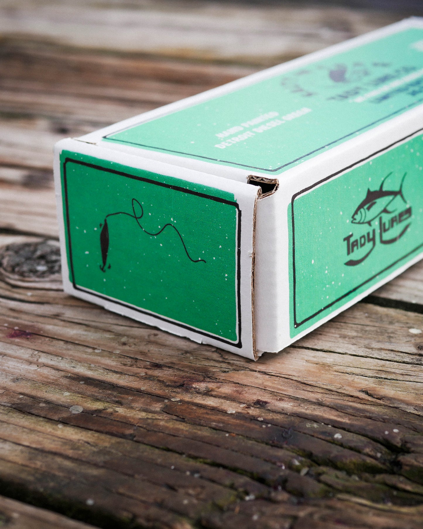 Detail photo of box of the SC X Tady Lure Jig Set - Detroit Diesel Green. 