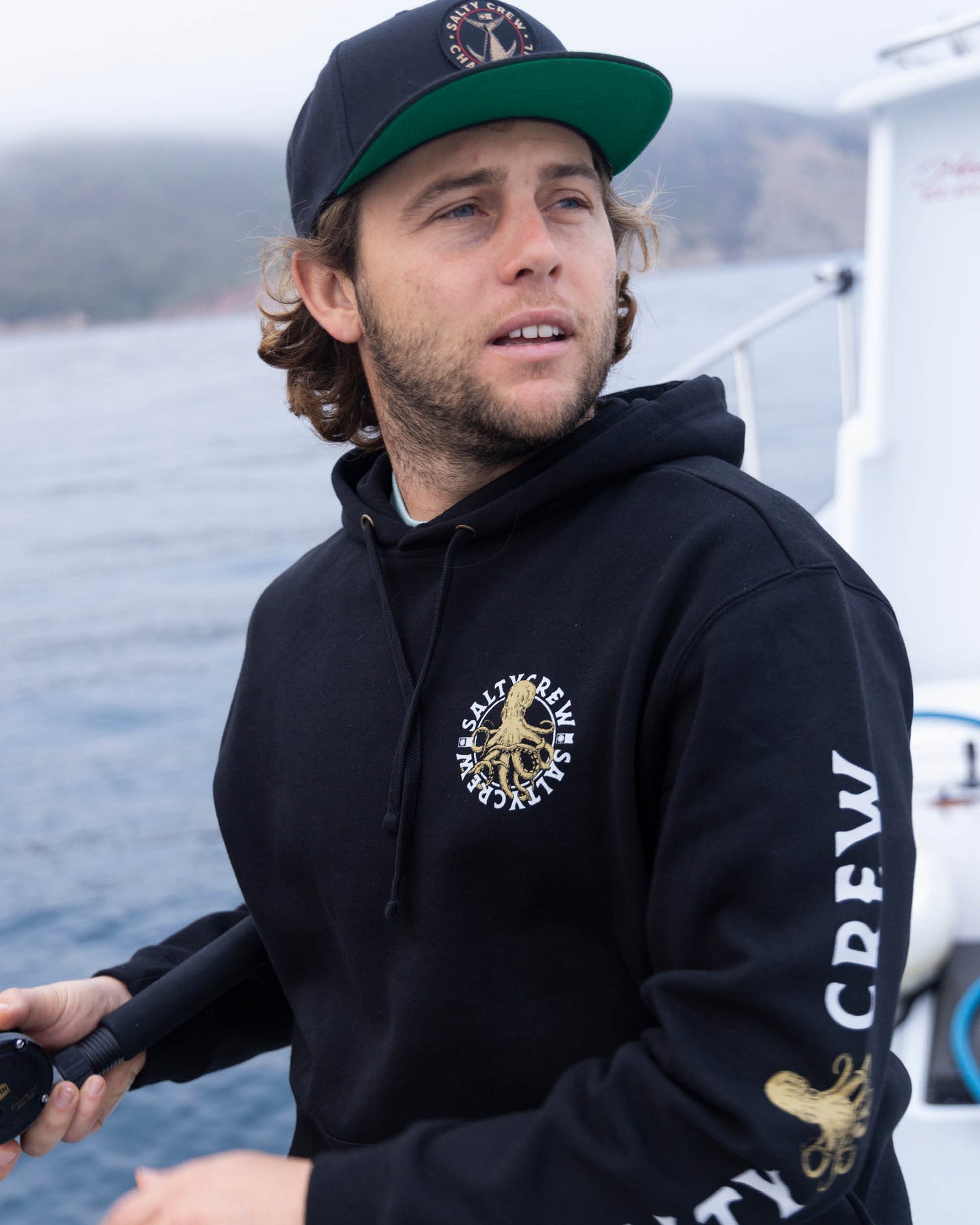 Lifestyle shot of the Tentacles Fleece Hoodie - Black. 