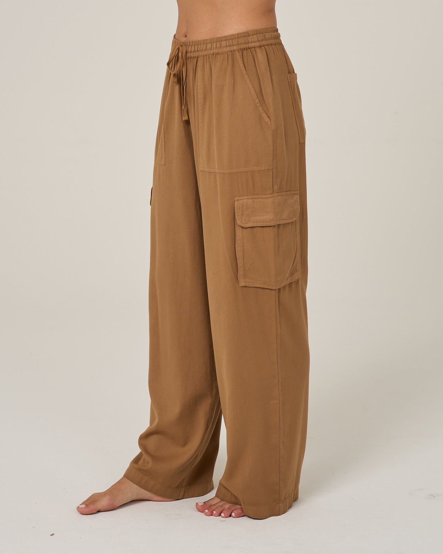 Profile view of the Driftwood Pant - Bronze Brown. 