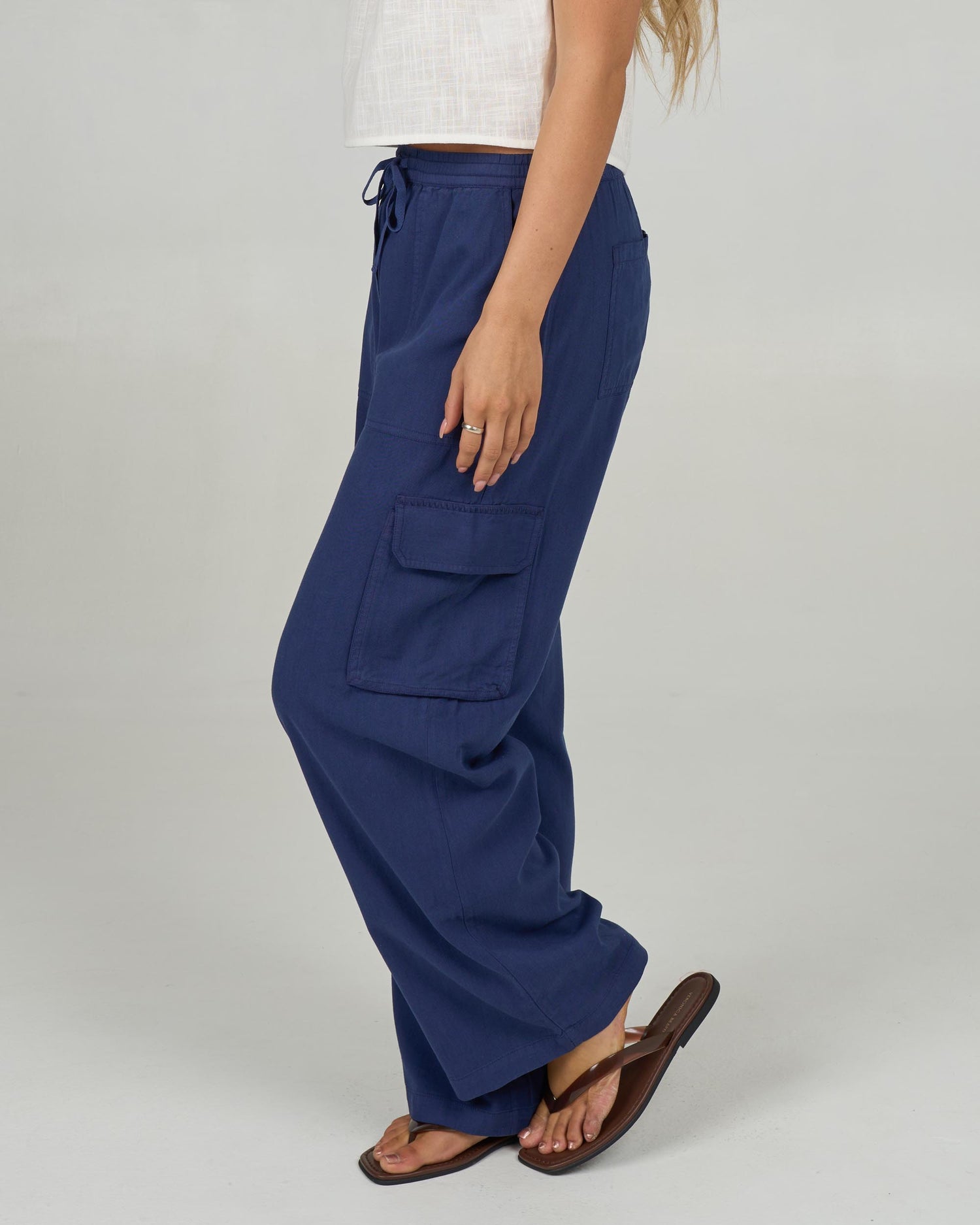 Profile view of the Driftwood Pant - Bright Navy. 