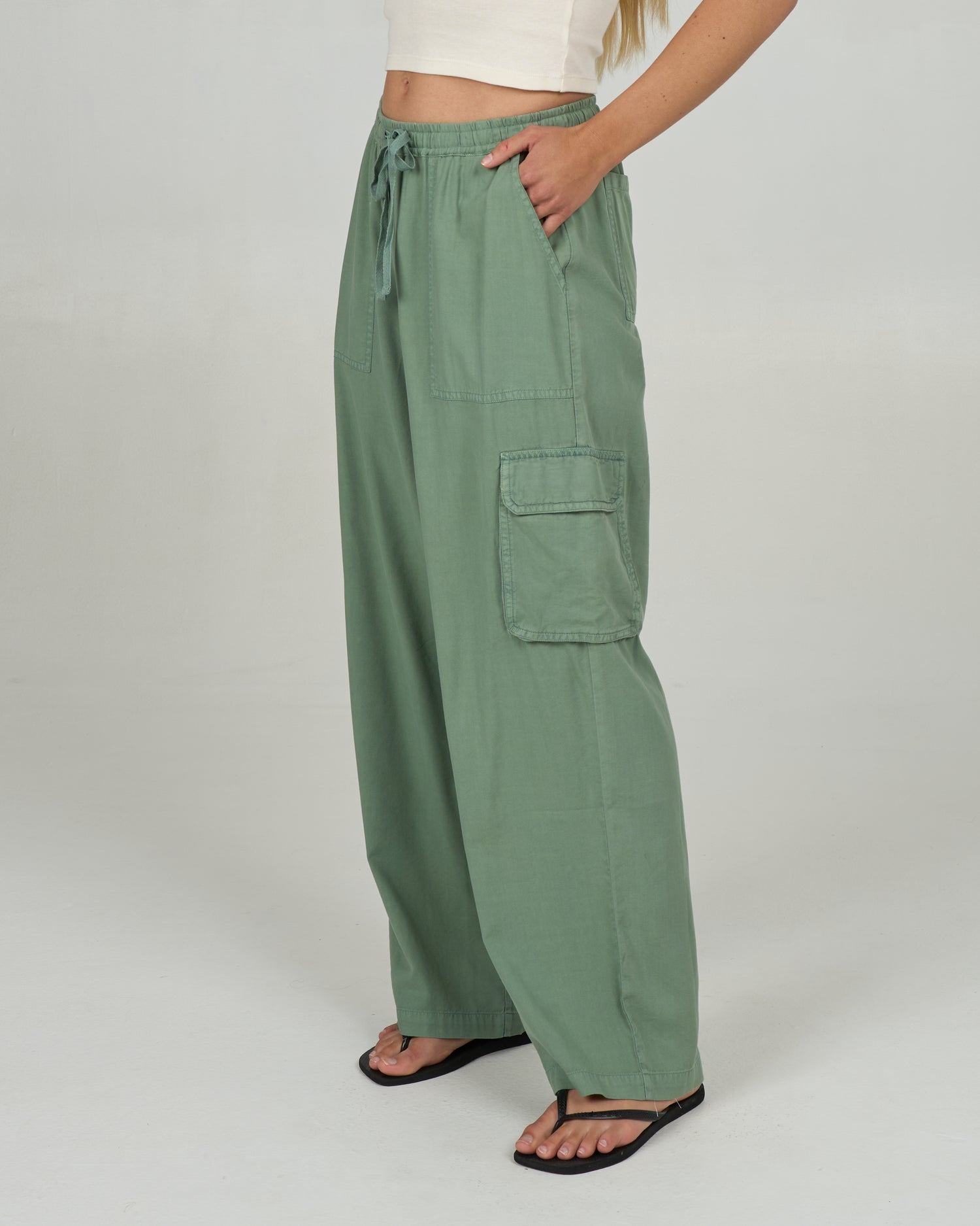 Profile view of the Driftwood Pant - Green Bay. 