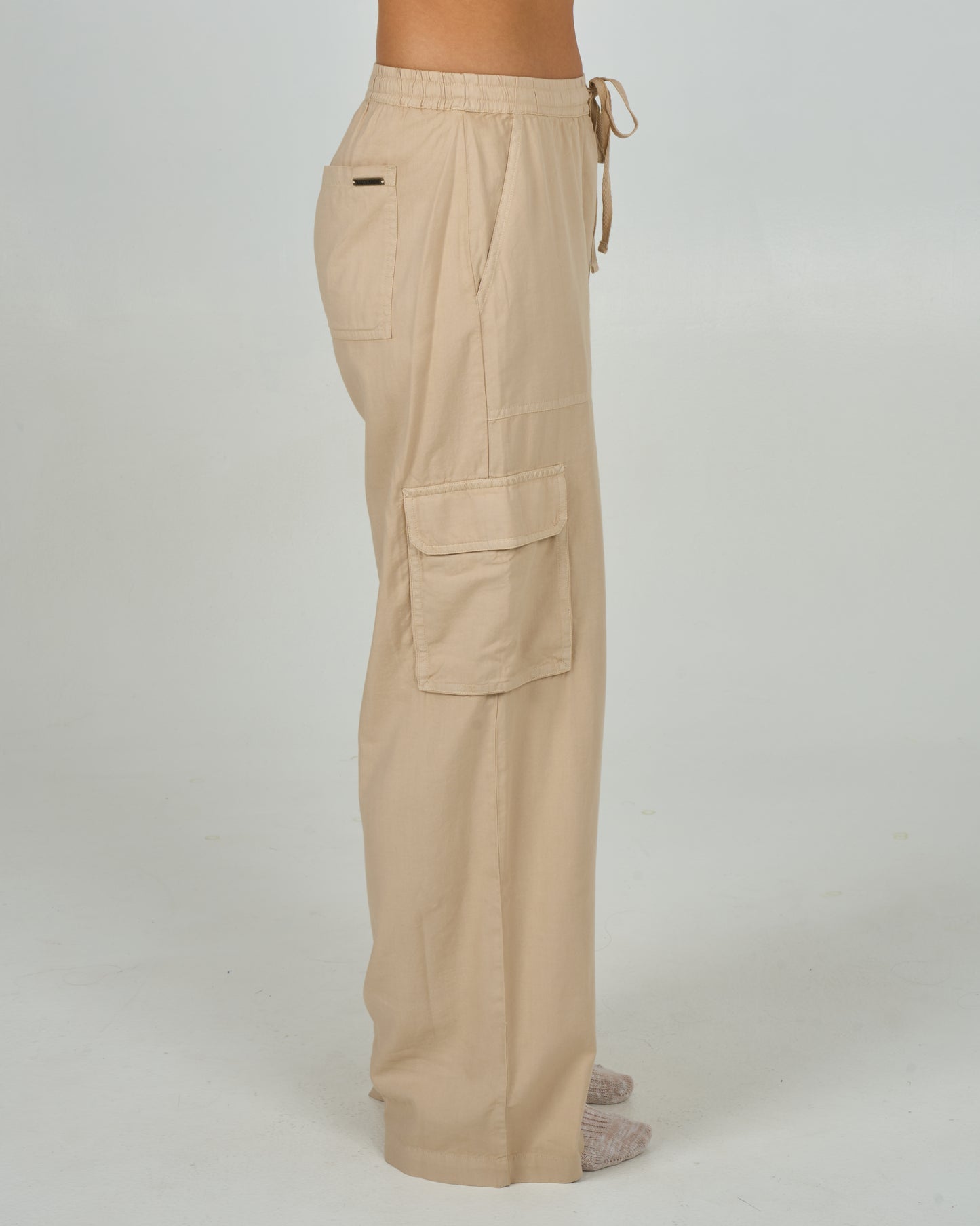 Profile view of the Driftwood Pant - Sand Dune. 