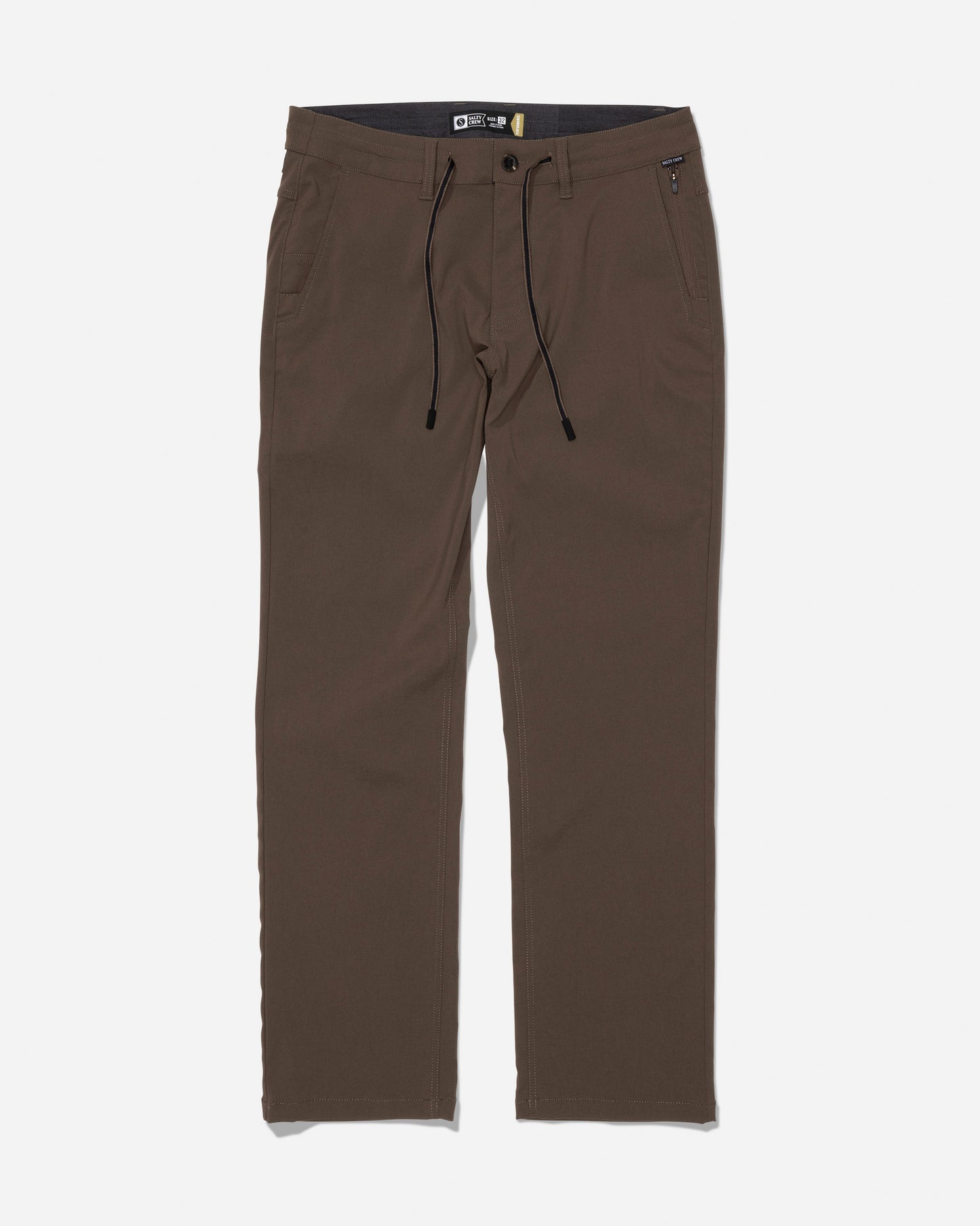 The Salty Crew Transom Tech Pant in washed brown showcases a straight-leg silhouette crafted from recycled performance fabric, with a button closure, zip fly, black drawstring, belt loops, and both front and back pockets, displayed on a white background.