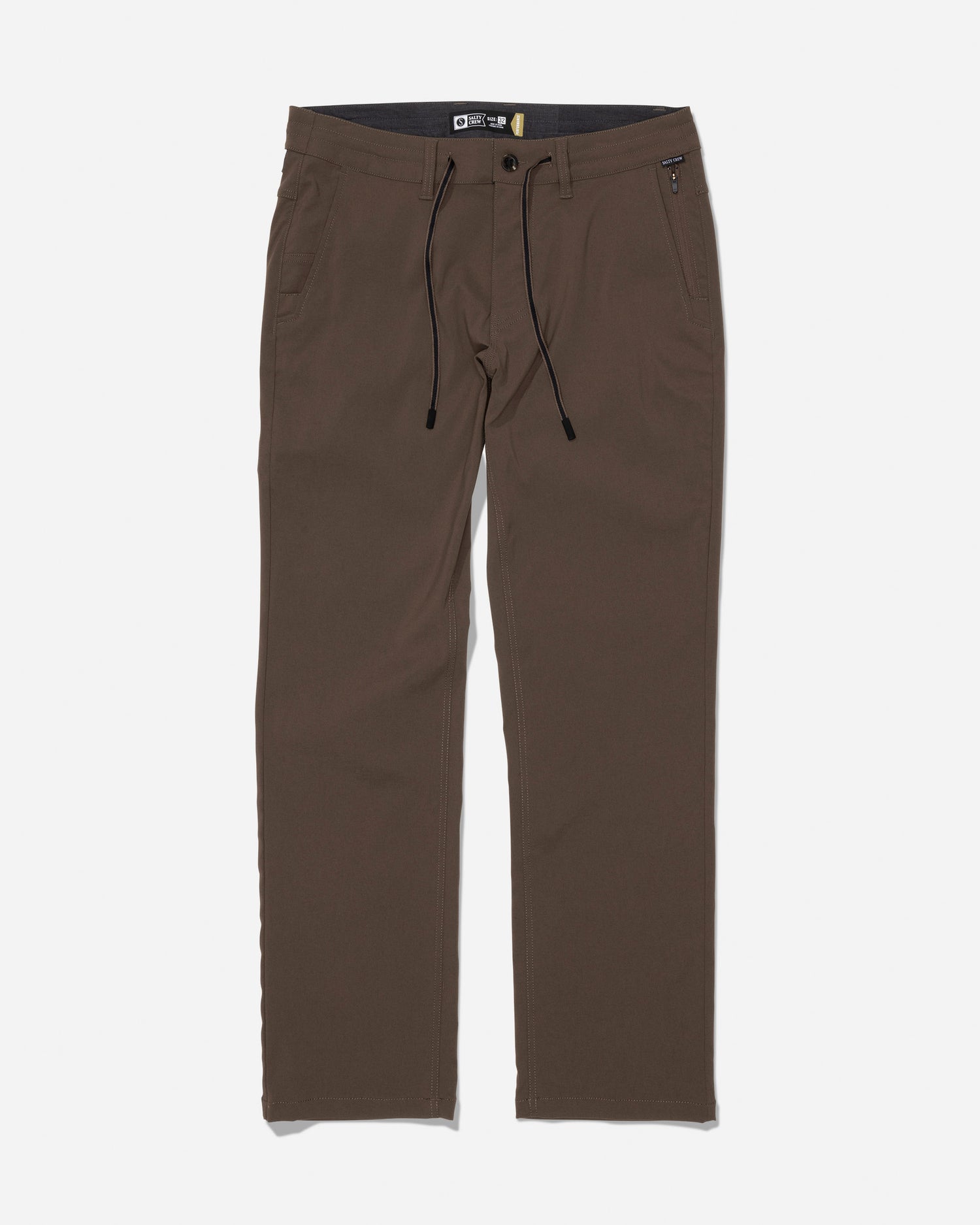The Salty Crew Transom Tech Pant in washed brown showcases a straight-leg silhouette crafted from recycled performance fabric, with a button closure, zip fly, black drawstring, belt loops, and both front and back pockets, displayed on a white background.