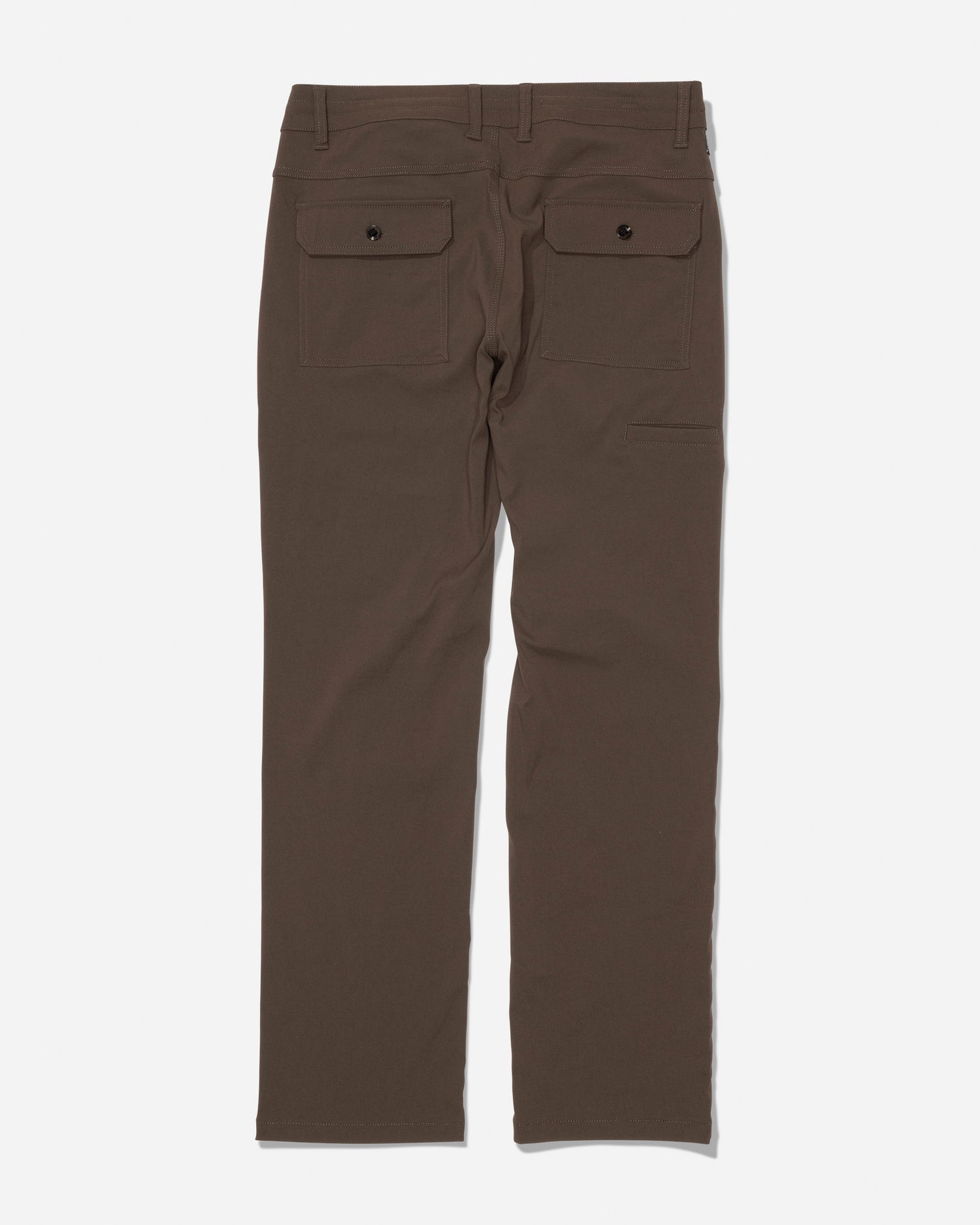 The Salty Crew Transom Tech Pant in Washed Brown is displayed from the back, showcasing two back pockets with buttoned flaps and belt loops at the waistband. Made from stain resistant, quick dry fabric, these pants are laid flat on a white background.