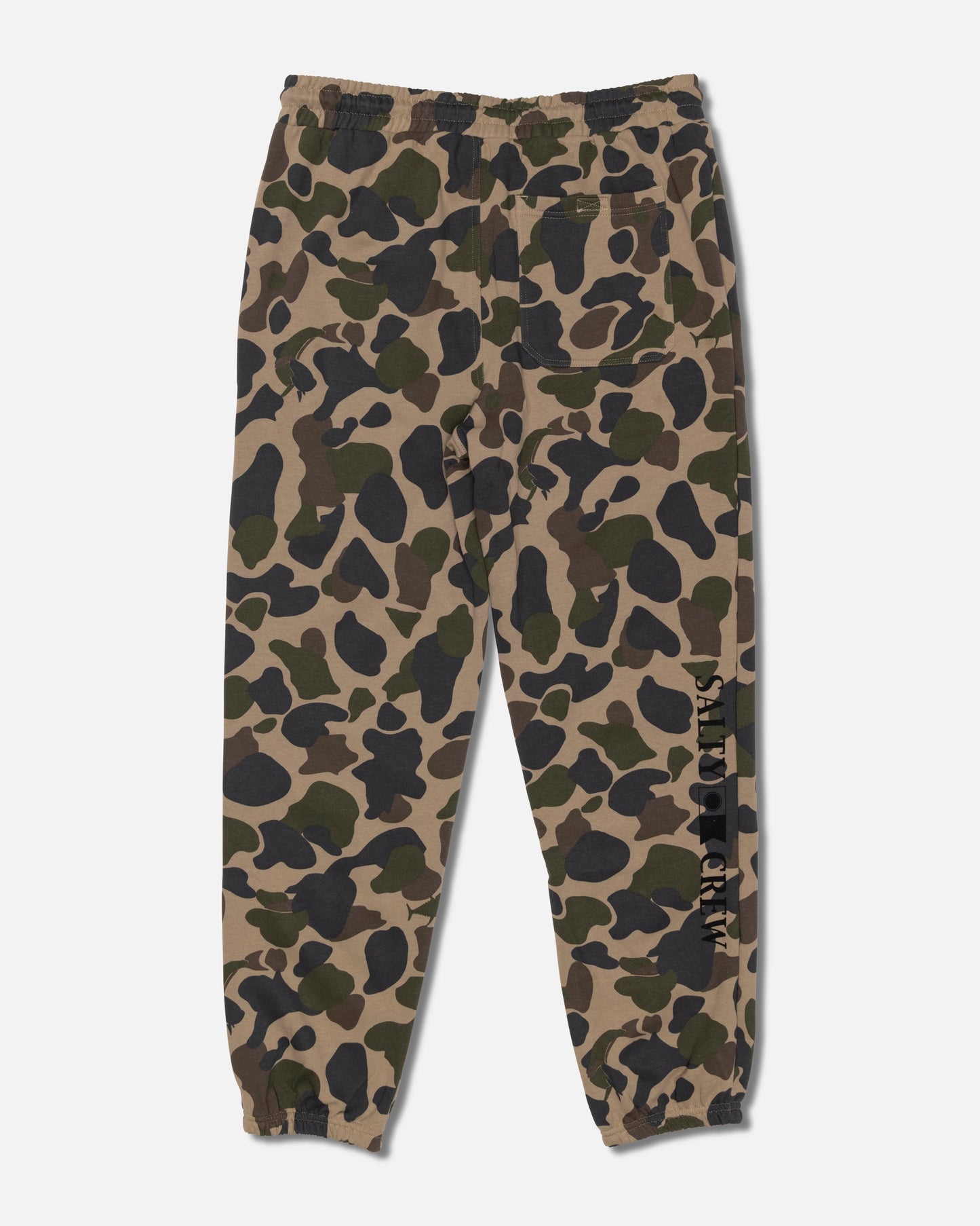 Salty Crew Crewser Fleece Pant in Sand Camo features a camouflage pattern, elastic waistband and cuffs, side hand pockets, a back pocket, and “Salty Crew” text printed vertically on one leg.