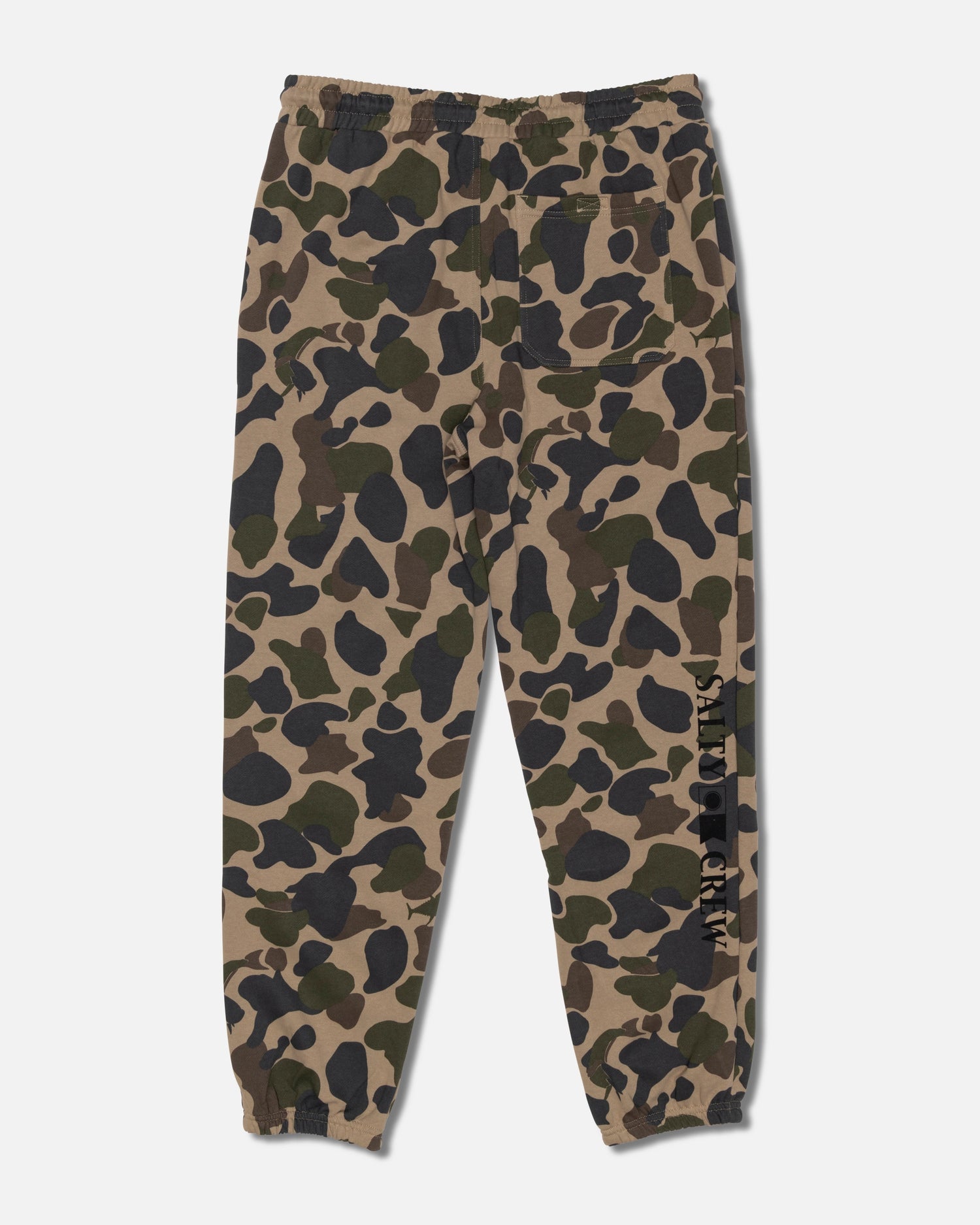 Salty Crew Crewser Fleece Pant in Sand Camo features a camouflage pattern, elastic waistband and cuffs, side hand pockets, a back pocket, and “Salty Crew” text printed vertically on one leg.