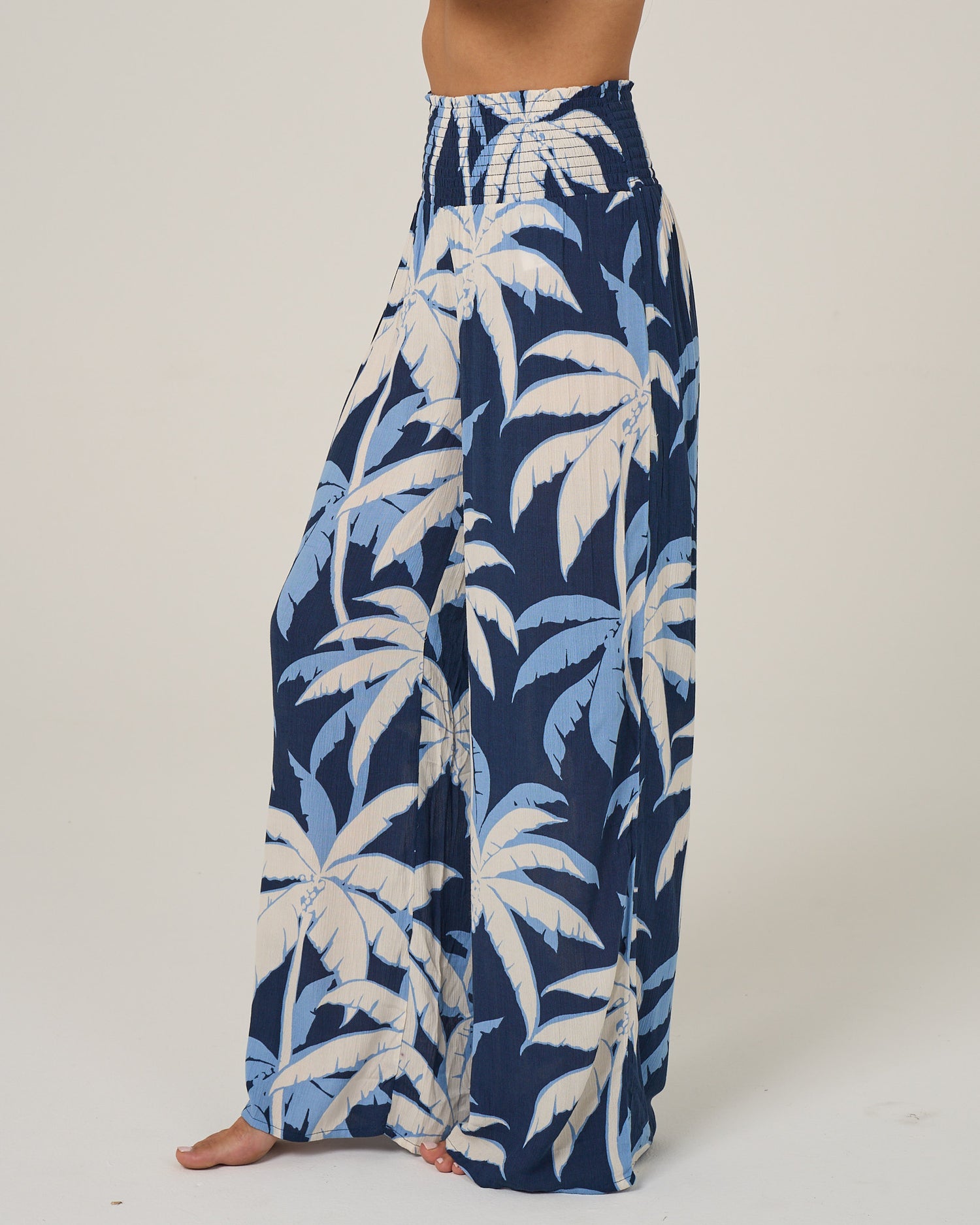 Profile view of the Palms Up Pant - Bright Navy. 