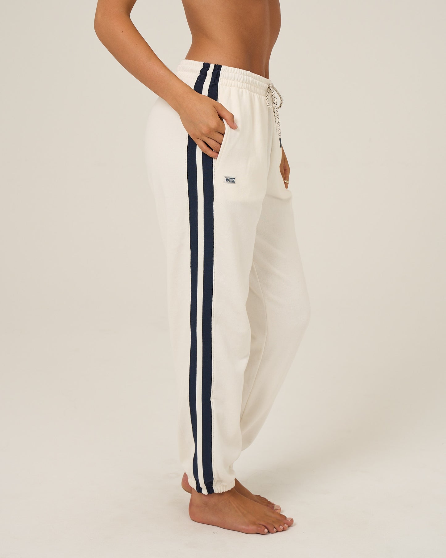 Profile view of the Maritime Sweatpant - Off White. 