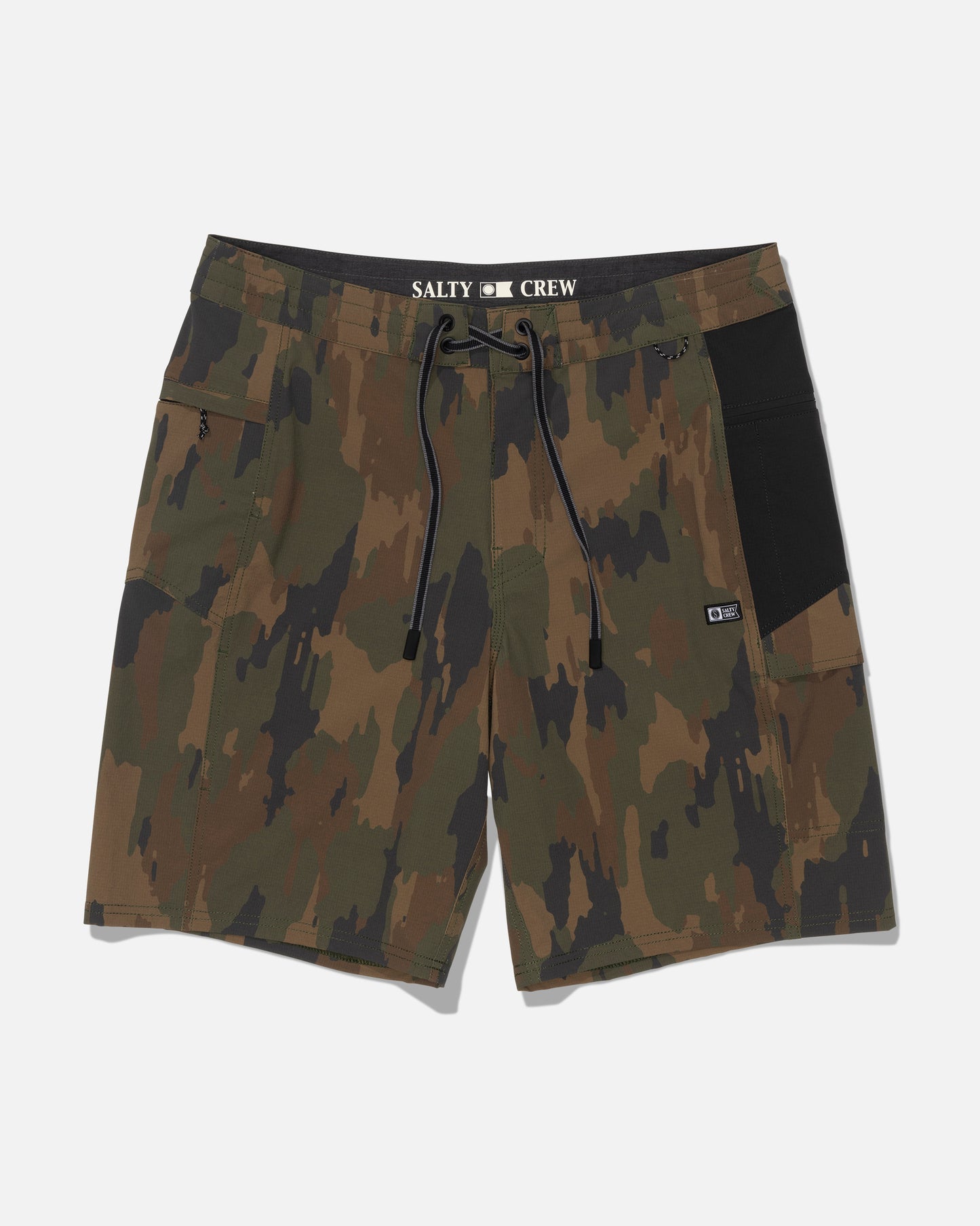 The Salty Crew Flagship 20″ Boatshort - Ranger features a green and brown camouflage design with a black drawstring, black side pocket, and Salty Crew branding on the waistband. Made from durable ripstop fabric for long-lasting wear, these board shorts are shown on a plain white background.