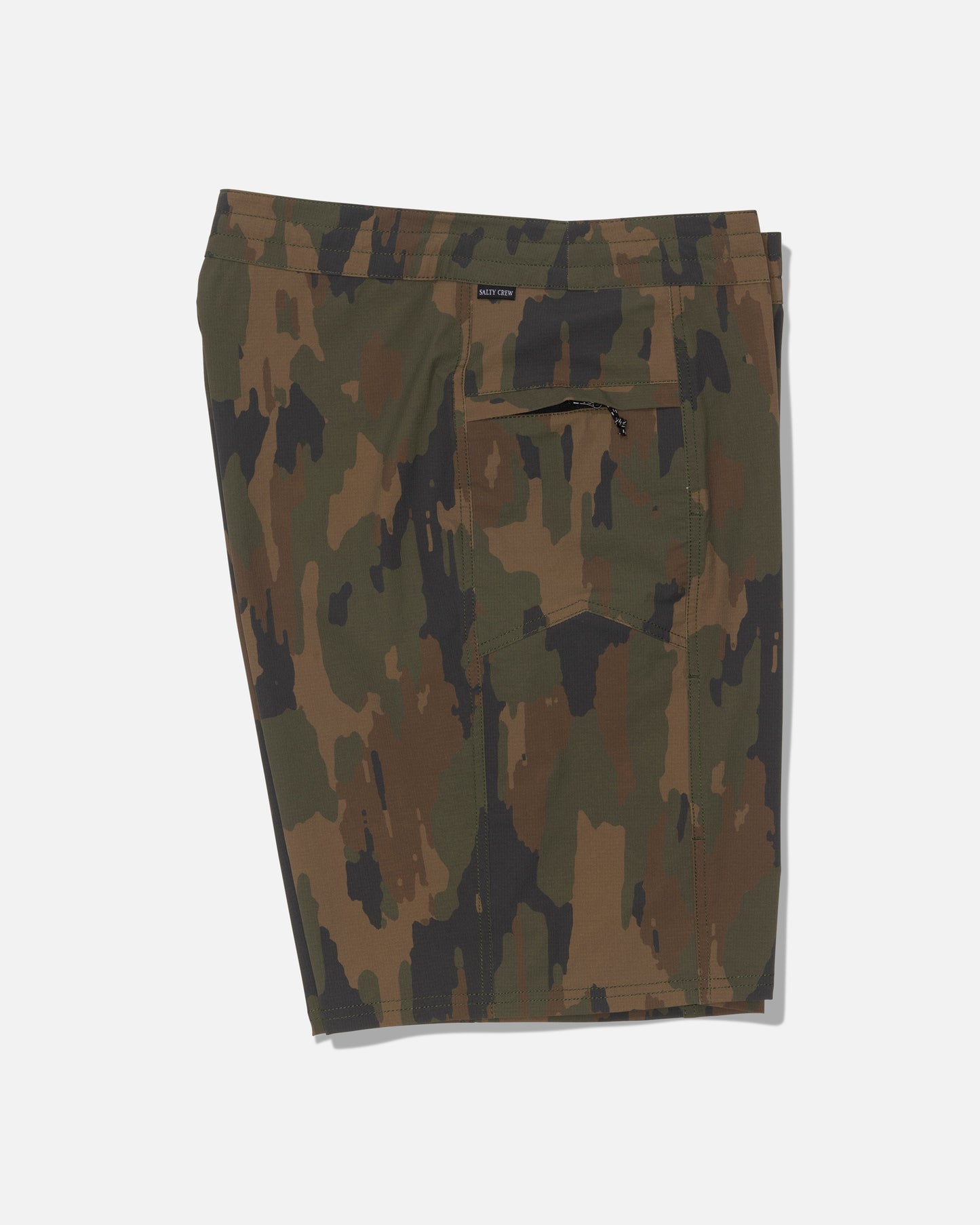 Salty Crew’s Flagship 20″ Boatshort - Ranger is a pair of knee-length shorts in a green and brown camouflage pattern, made from durable ripstop fabric with 4-way stretch for superior comfort and mobility. Featuring a zippered back pocket, these shorts are shown against a plain white background.