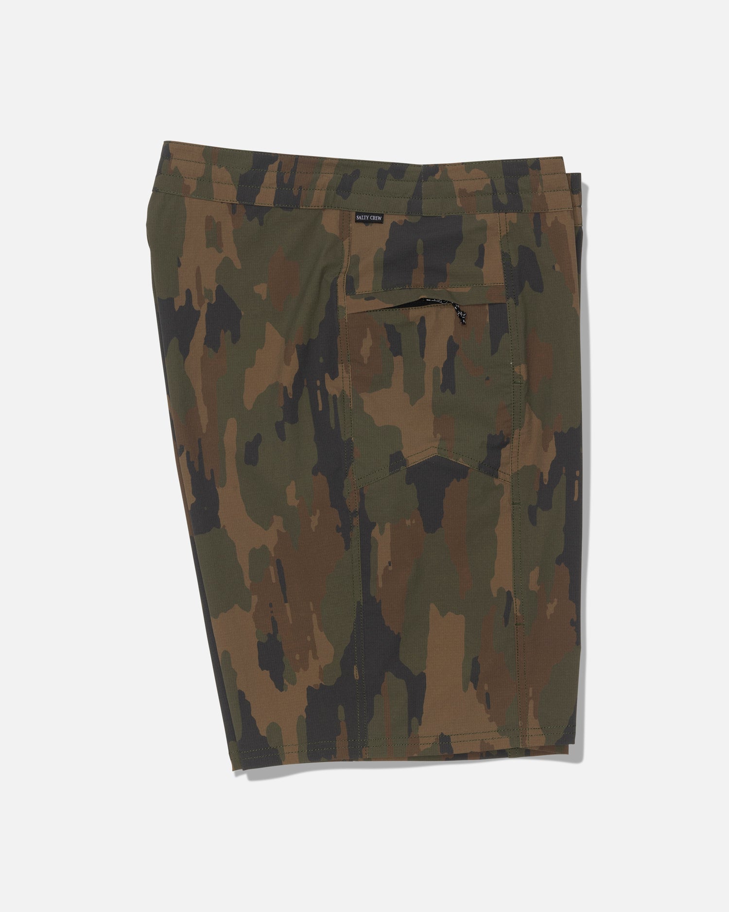 Salty Crew’s Flagship 20″ Boatshort - Ranger is a pair of knee-length shorts in a green and brown camouflage pattern, made from durable ripstop fabric with 4-way stretch for superior comfort and mobility. Featuring a zippered back pocket, these shorts are shown against a plain white background.