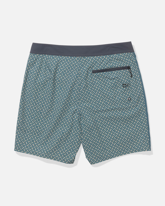 The Salty Crew Channel 18" Apex Boardshort - Oceanic features a blue-green geometric print, dark waistband, right zippered back pocket, and is crafted from quick-dry performance fabric.