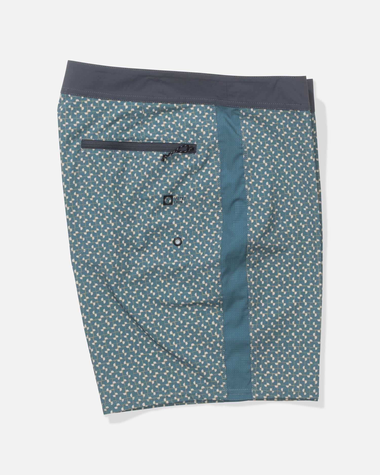 The Salty Crew Channel Apex Boardshort - Oceanic features teal fabric with a white geometric pattern, black waistband, zippered back pocket, accent vertical stripe, and quick-dry 4-way stretch material. Shorts are laid flat on a white background.