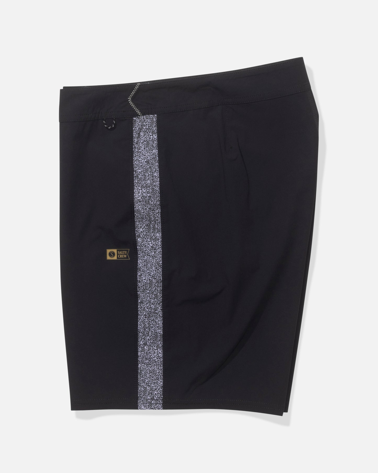 The Salty Crew Channel 18" Apex Boardshort in Pirate Black features a vertical white speckled stripe on one side and a small black and gold patch near the stripe, made from durable performance fabric. Displayed on a plain white background.