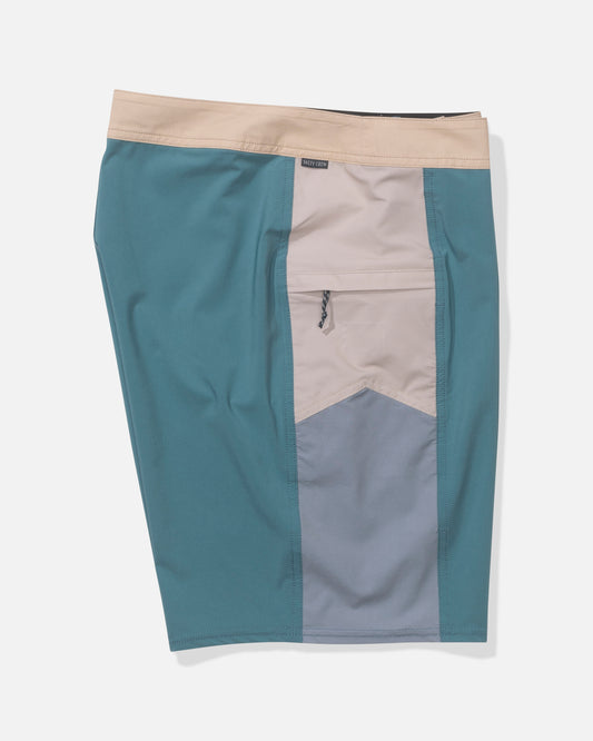 The Salty Crew Flagship 20" Boardshort - Oceanic features teal, beige, and light gray color-block panels, quick-dry fabric, and a visible front right zipper pocket. The shorts are displayed flat against a white background.
