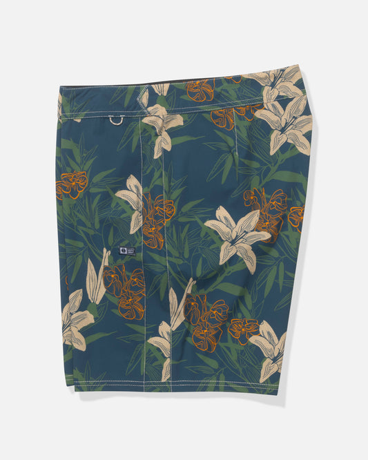 The Salty Crew Channel 18" Boardshort in Cast Blue features a beige and orange lily floral print, green leaves, quick-dry fabric, plus a back pocket with logo tag.