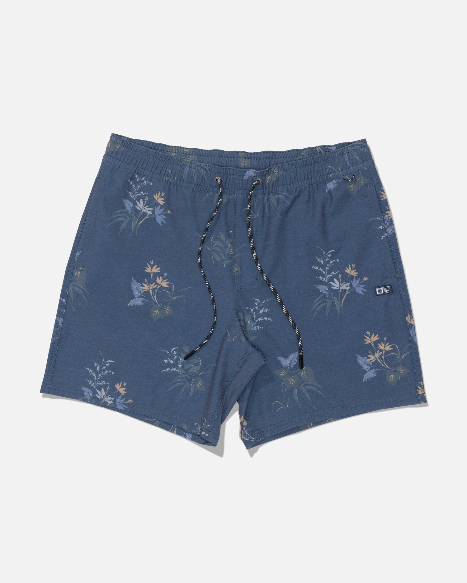 Introducing the Salty Crew Crew Volley 17″ swim shorts in Mid Blue, featuring a subtle floral print and crafted from recycled polyester for an eco-conscious choice. Designed with a black-and-white drawstring, small side logo tag, and a classic straight leg silhouette, these shorts are displayed laid flat on a white background.