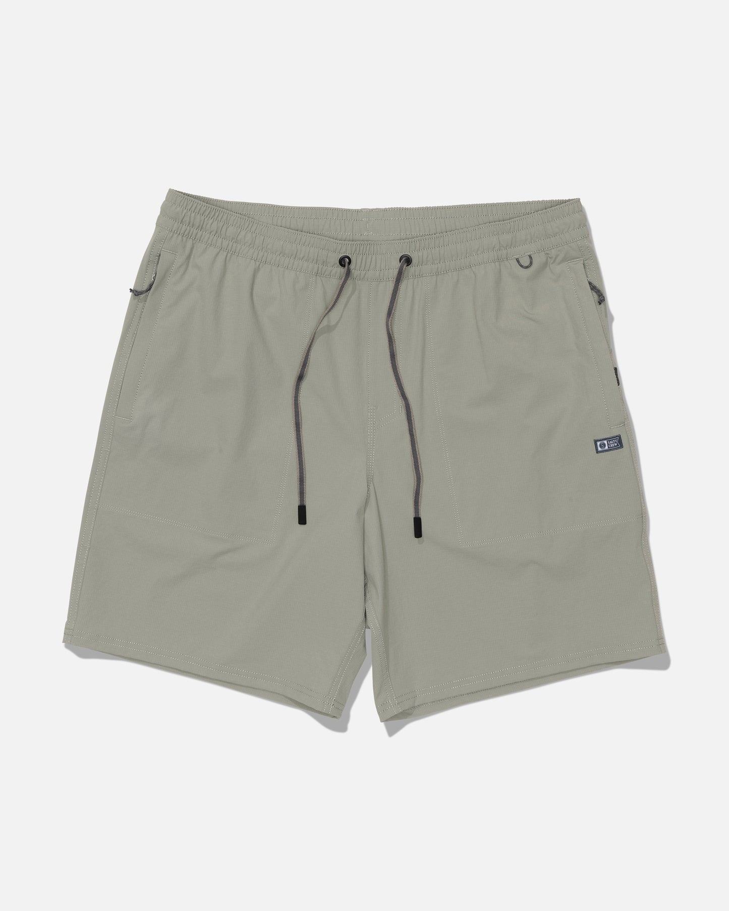 The Salty Crew Crew 18″ Ewaist Boatshort in Aqua Grey is crafted from quick-dry ripstop fabric and features an elastic waistband with black drawstrings, side pockets, and a small black tag on the right side. The shorts are displayed laid flat on a white background.