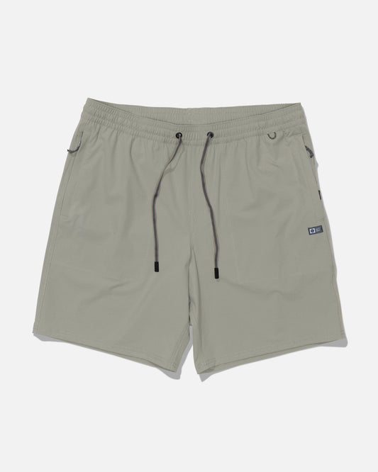 The Salty Crew Crew 18″ Ewaist Boatshort in Aqua Grey is crafted from quick-dry ripstop fabric and features an elastic waistband with black drawstrings, side pockets, and a small black tag on the right side. The shorts are displayed laid flat on a white background.