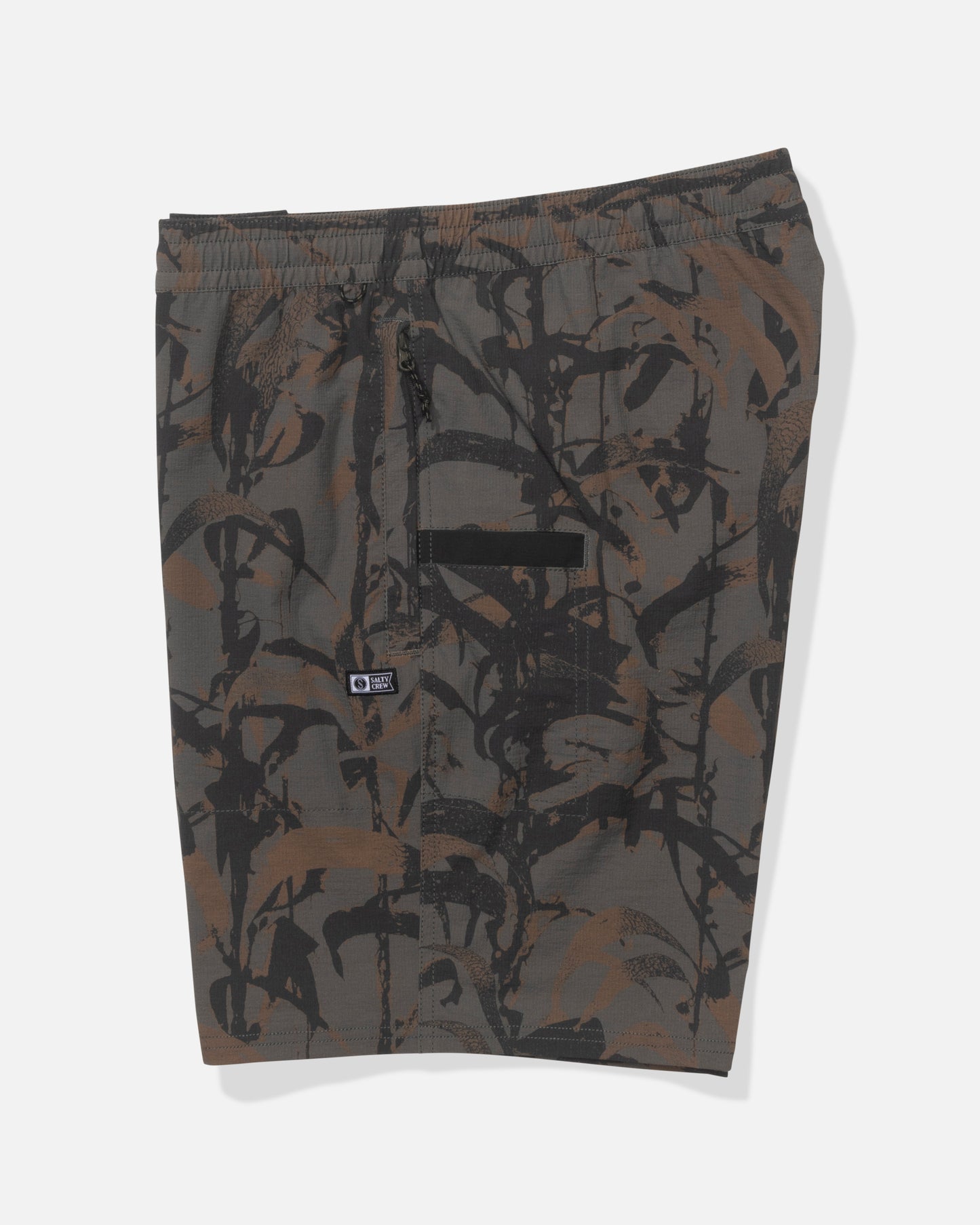 The Salty Crew Crew 18" Ewaist Boatshort in Dark Kelp Camo features a brown and black camo pattern, elastic waistband with drawstring, zippered front pocket, and durable ripstop fabric for lasting comfort.