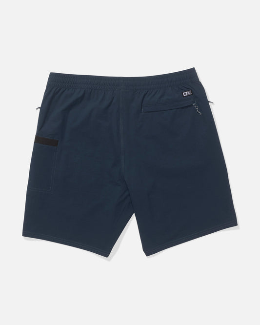 Salty Crew Crew 18" Ewaist Boatshort in navy, shown from the back, features 4-way stretch ripstop fabric, an elastic waistband, a right zippered back pocket, and a left open patch pocket.