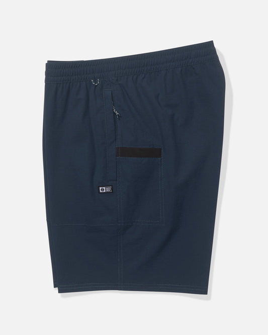 The Salty Crew Crew 18" Ewaist Boatshort in navy features an elastic waistband, front zipper pocket, black front accent, visible stitching, and quick-dry ripstop fabric, shown on a plain white background.