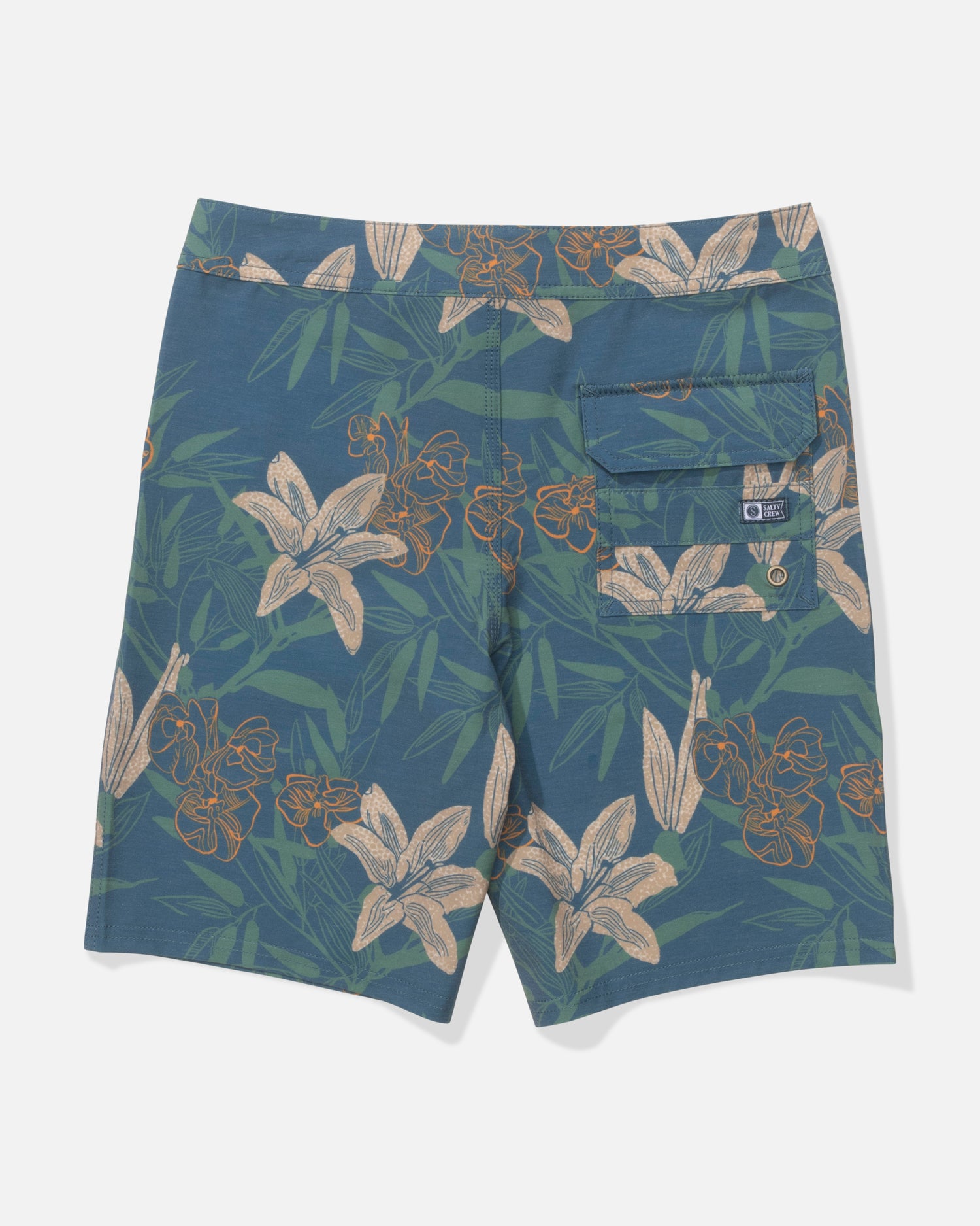 The Salty Crew Boys Boardshort in Cast Blue features a blue and green floral pattern with beige and orange flowers, a buttoned back pocket, and a small fabric label by the pocket. The straight leg shorts are shown flat from the back.