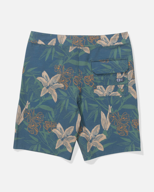 The Salty Crew Crew 17" Boys Boardshort in Cast Blue features a floral print with beige and orange flowers, green leaves, a buttoned back pocket, and a small label above it. Made from recycled polyester, shown from the back.