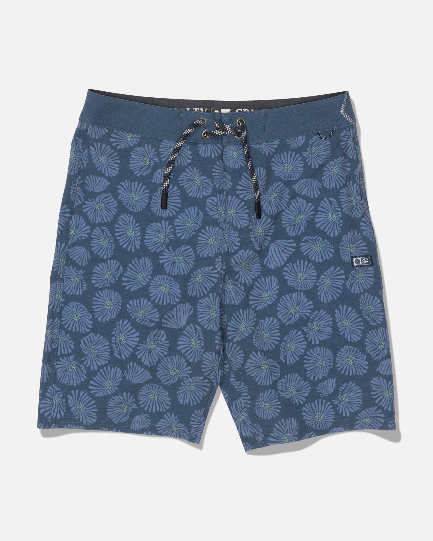 The Salty Crew Crew 17″ Boys Boardshort in Hitch Blue features a drawstring waist and a light blue and green tropical leaf pattern, crafted from comfort fabric with 4-way stretch for easy movement, displayed against a white background.