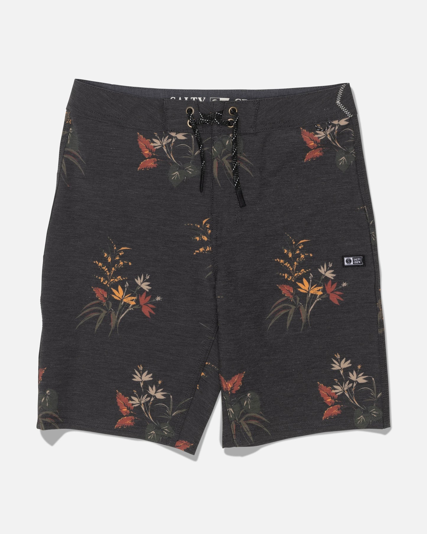 The Salty Crew Crew 19″ Boardshort in Off Black features a vibrant floral design with orange, yellow, and beige flowers and leaves. Made from recycled polyester for sustainable style, these board shorts offer a drawstring waistband and a small branded patch on one leg. The comfortable fabric ensures effortless movement, making them ideal for all-day wear.