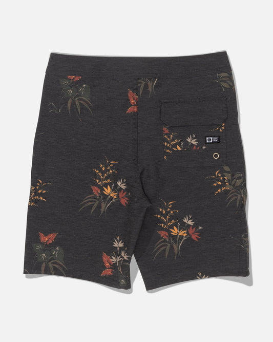 Salty Crew’s Crew 17″ Boys Boardshort in Off Black features a subtle floral pattern in red, yellow, and green. Made from recycled polyester for an eco-friendly touch, these boardshorts include a single right back pocket with a button closure and a small black label.