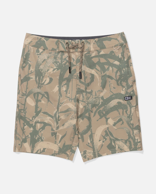 The Salty Crew Boys Boardshort - Sand Camo features a tan and green camouflage print with a subtle plant pattern, comfortable 4-way stretch fabric, straight leg, drawstring waistband, and a small brand patch on the left leg.