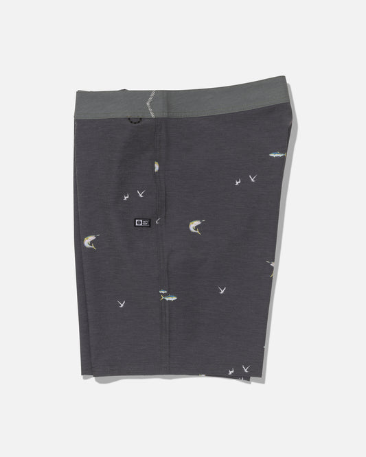 Salty Crew’s Crew 19″ Boardshort in dark grey features a green-gray waistband and is made from recycled polyester, offering comfortable 4-way stretch. The boardshort displays a subtle fishing motif with small fish and bird illustrations, shown against a plain white background.