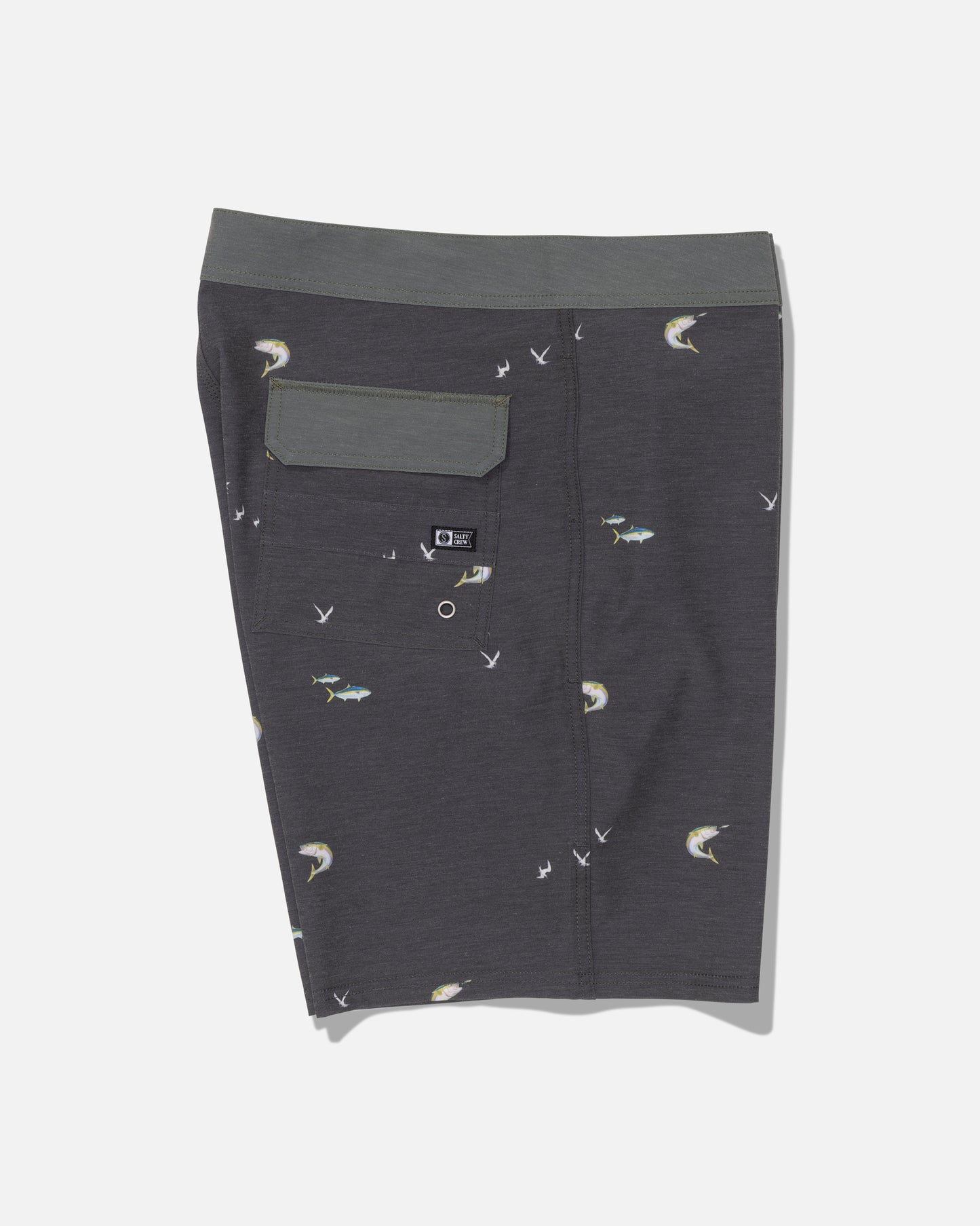 The Salty Crew Crew 19″ Boardshort in dark grey features a subtle fish and bird print, a green waistband, and a back flap pocket. Crafted from recycled polyester with a straight leg cut, these boardshorts are displayed flat against a white backdrop.