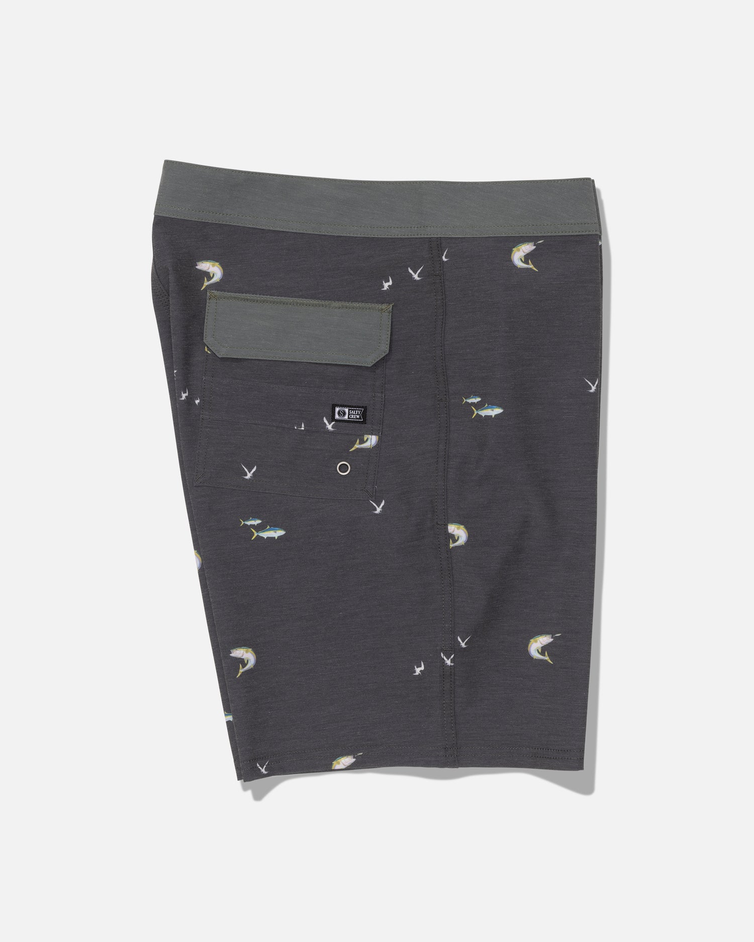 The Salty Crew Crew 19″ Boardshort in dark grey features a subtle fish and bird print, a green waistband, and a back flap pocket. Crafted from recycled polyester with a straight leg cut, these boardshorts are displayed flat against a white backdrop.