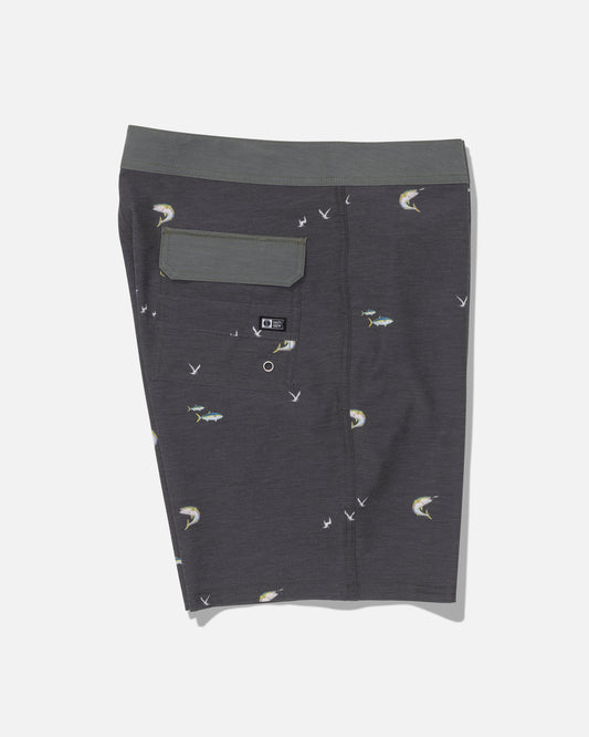 The Salty Crew Crew 19″ Boardshort in dark grey features a subtle fish and bird print, a green waistband, and a back flap pocket. Crafted from recycled polyester with a straight leg cut, these boardshorts are displayed flat against a white backdrop.