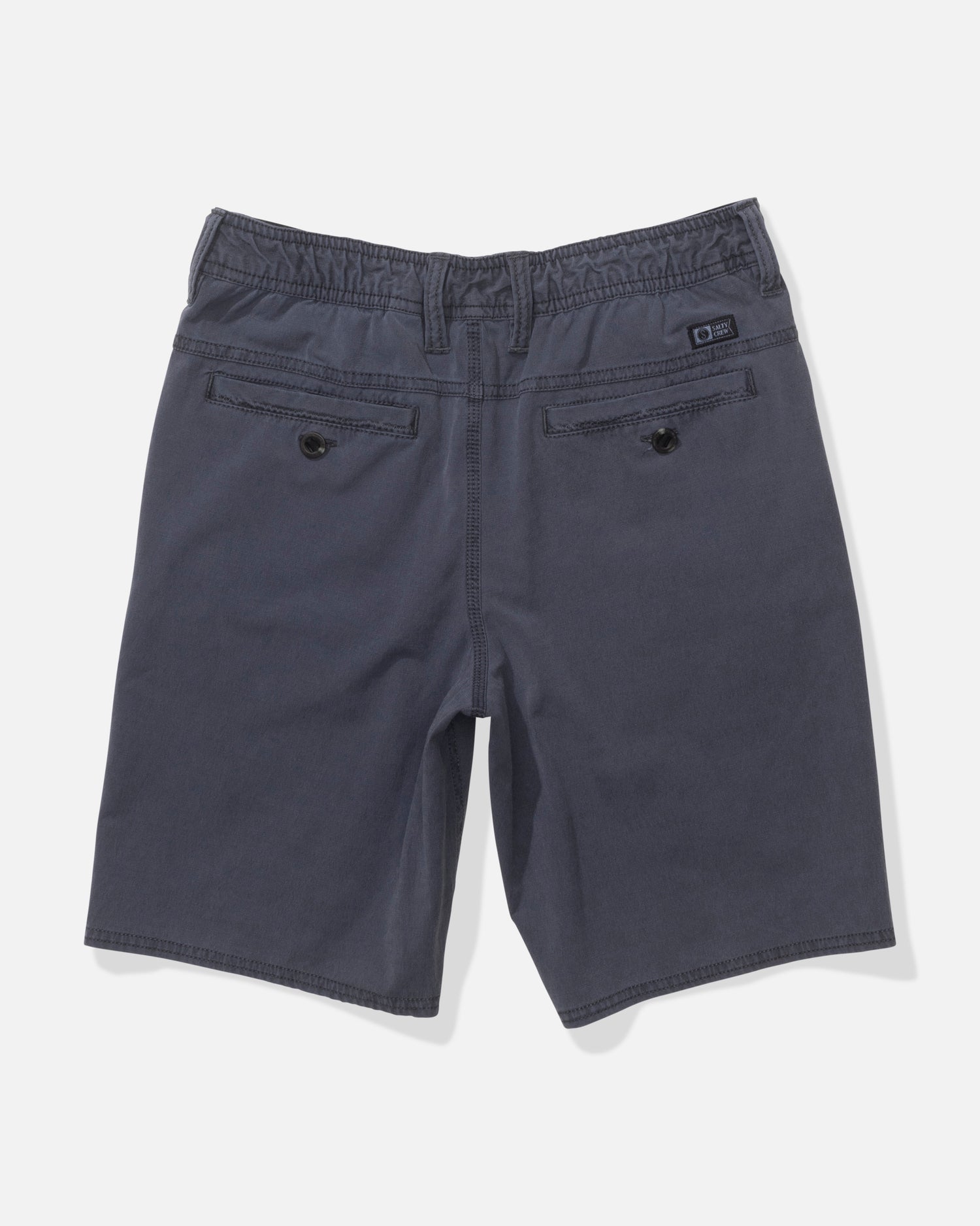 Back view of Salty Crew Transom 17" Boys Overdye Short in Magnet: dark gray straight leg, two buttoned back pockets, elastic waistband sides, subtle stitching, and 4-way stretch for comfort.